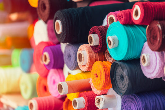 A rack of fabric rolls
