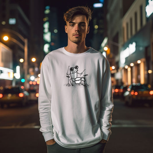 Guy wearing a white long sleeve t-shirt with a frog playing drums print