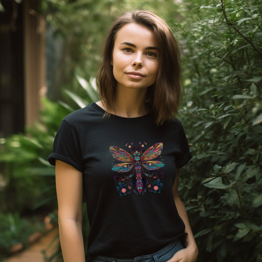 young woman wearing a black t-shirt with a colorful floral dragonfly print