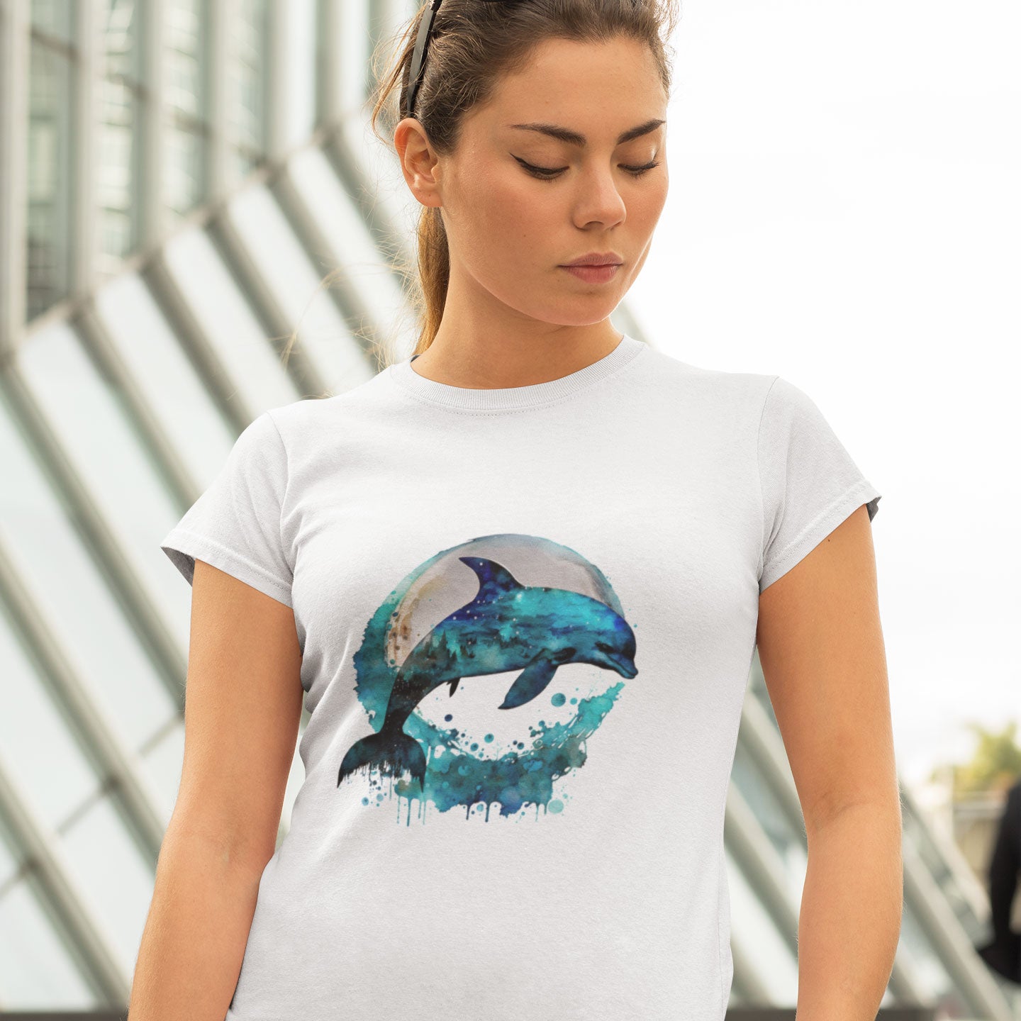 woman wearing a white t-shirt with a dolphin print