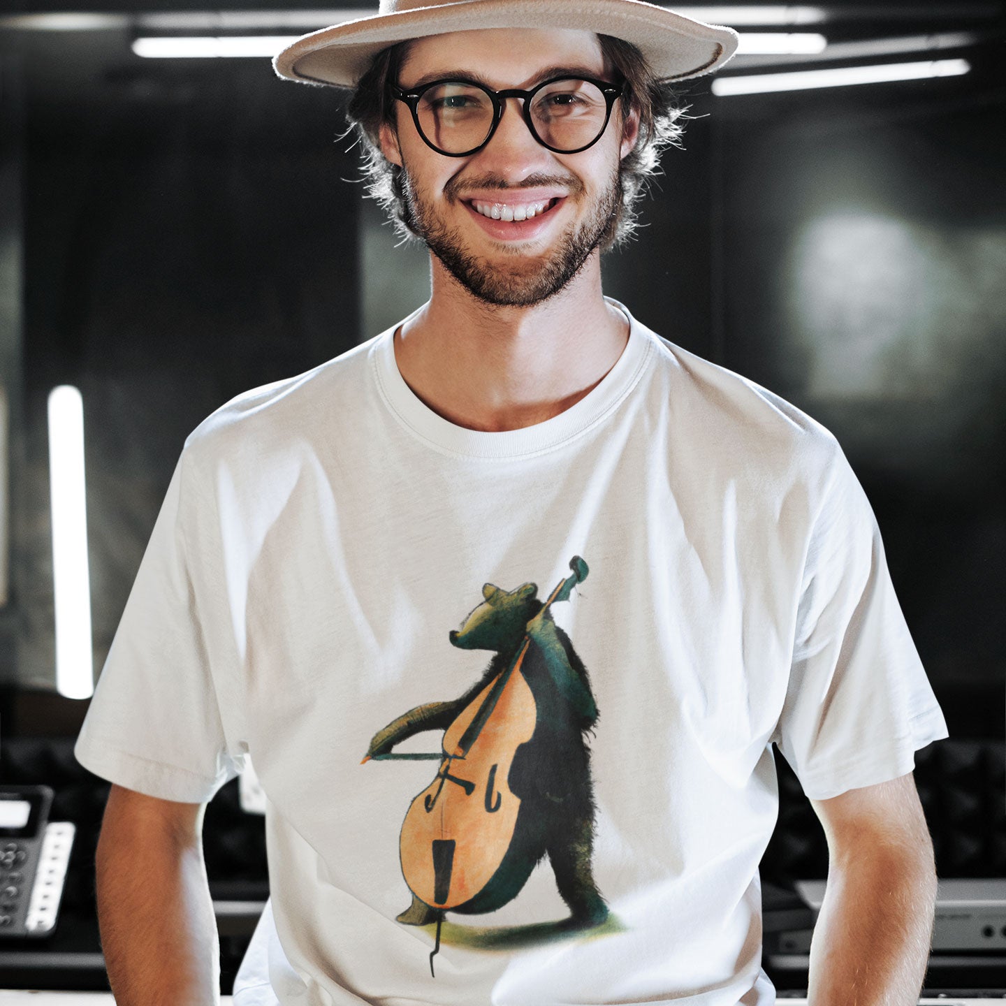 musician wearing a white t-shirt with a bear playing the double bass print