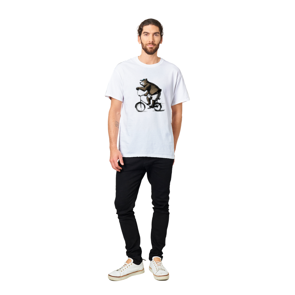 Man wearinga white t-shirt with a bear in shorts and cap  riding a bike