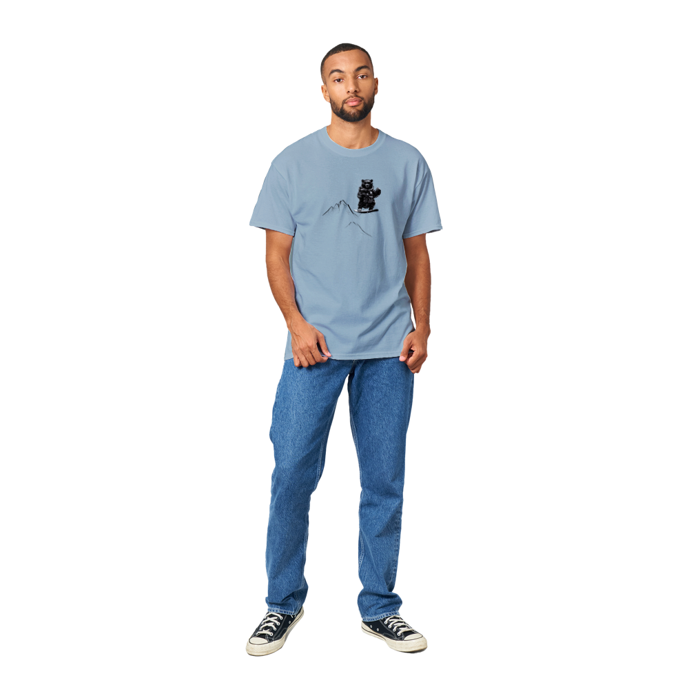 Guy wearing a light blue t-shirt with a snowboarding bear print