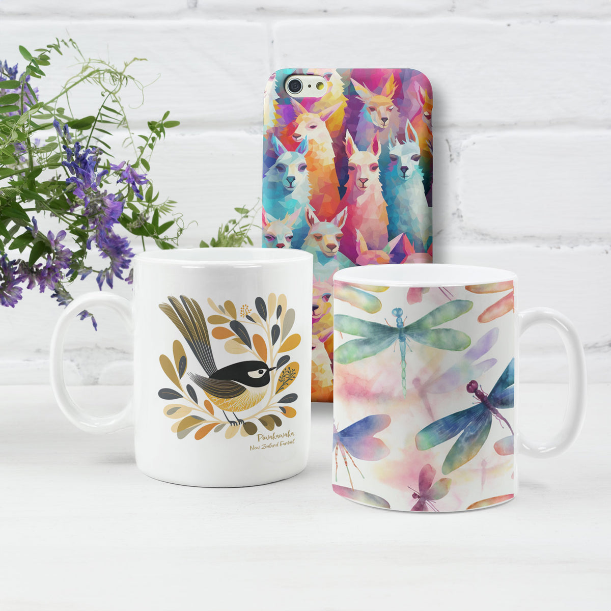 2 mugs and a phone case with designs from The Purple Melon