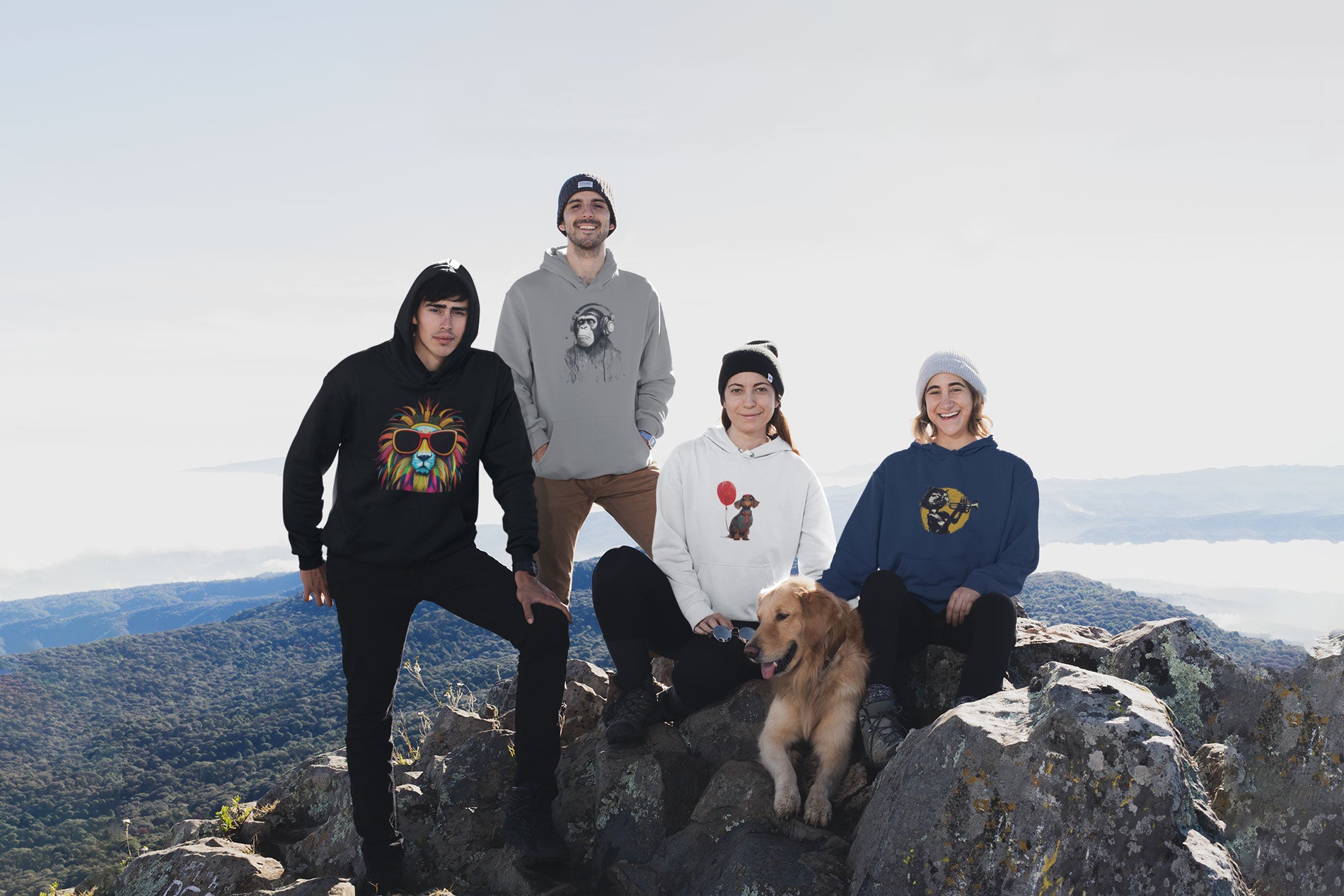 A group of friends with a dog on a mountain wearing some Hoodies designed by The Purple Melon