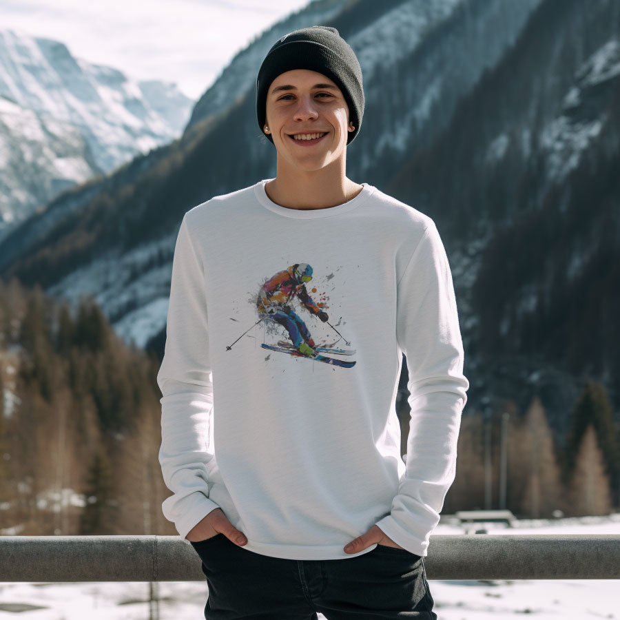 guy in the snow wearing a beanie and white long sleeve t-shirt with a skier print