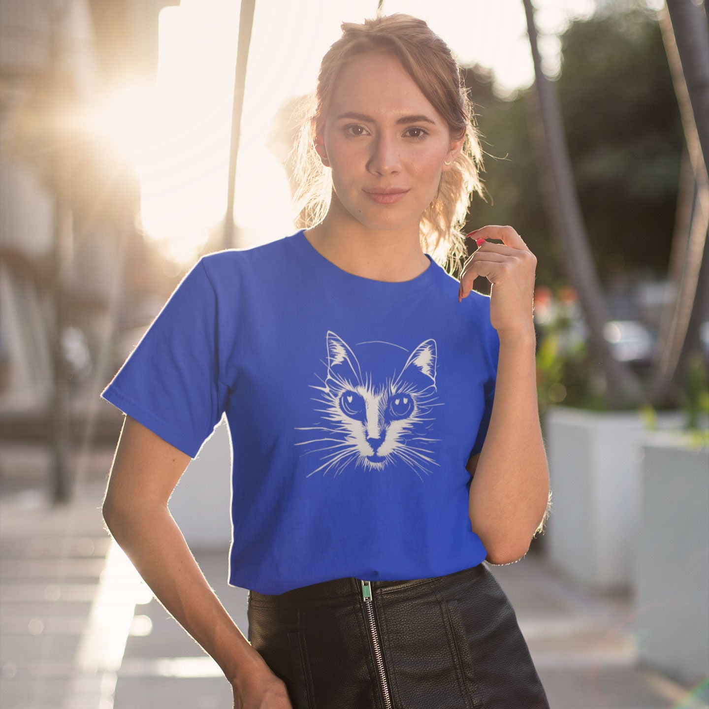 woman wearing a royal blue t-shirt with a cat print