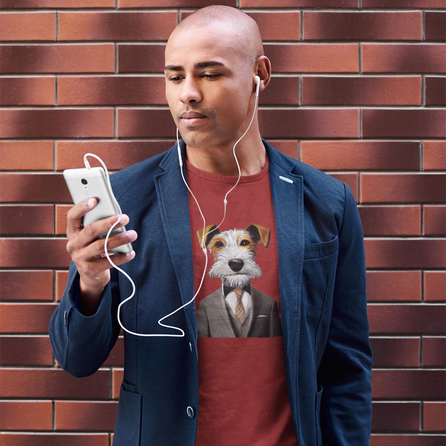 Man listening to music wearing a red t-shirt with a fox terrier in a suit print
