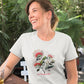 Woman wearing a white t-shirt with a new zealand rata flower print