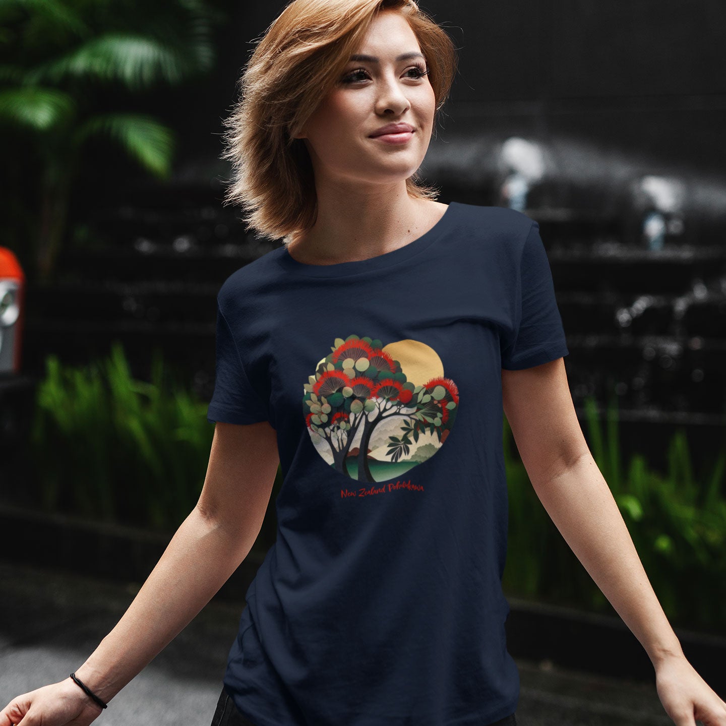woman wearing a navy t-shirt with a new zealand pohutukawa tree print