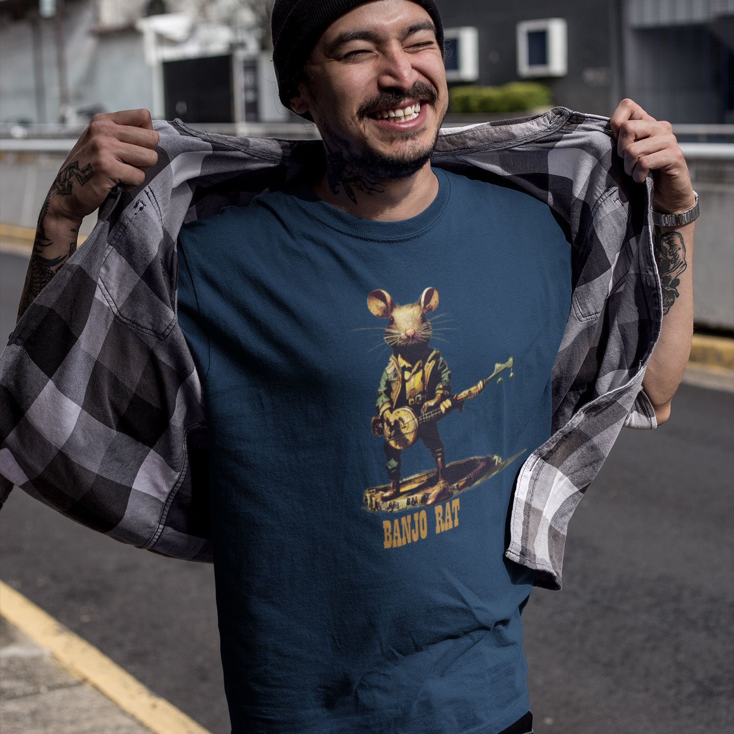A guy wearing a navy t-shirt with a print of a rat playing the banjo print on the front