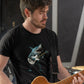 Guy playing guitar wearing a black t-shirt with a shark playing guitar print