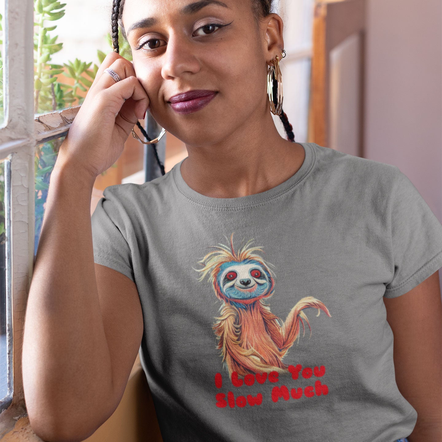 Woman wearing a t-shirt with a sloth and the caption I love you slow much
