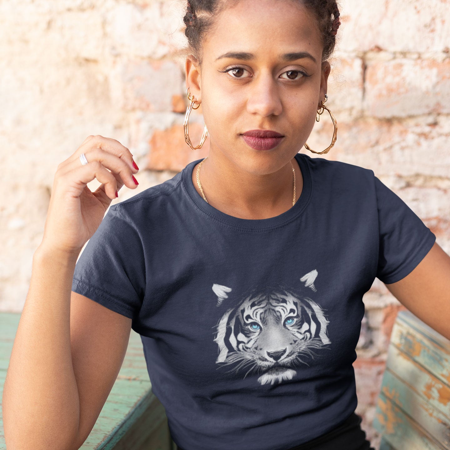 Girl wearing a navy blue t-shirt with a tiger print
