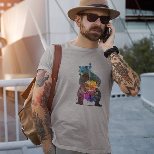 Guy wearing a grey t-shirt with a bear playing a colourful double bass