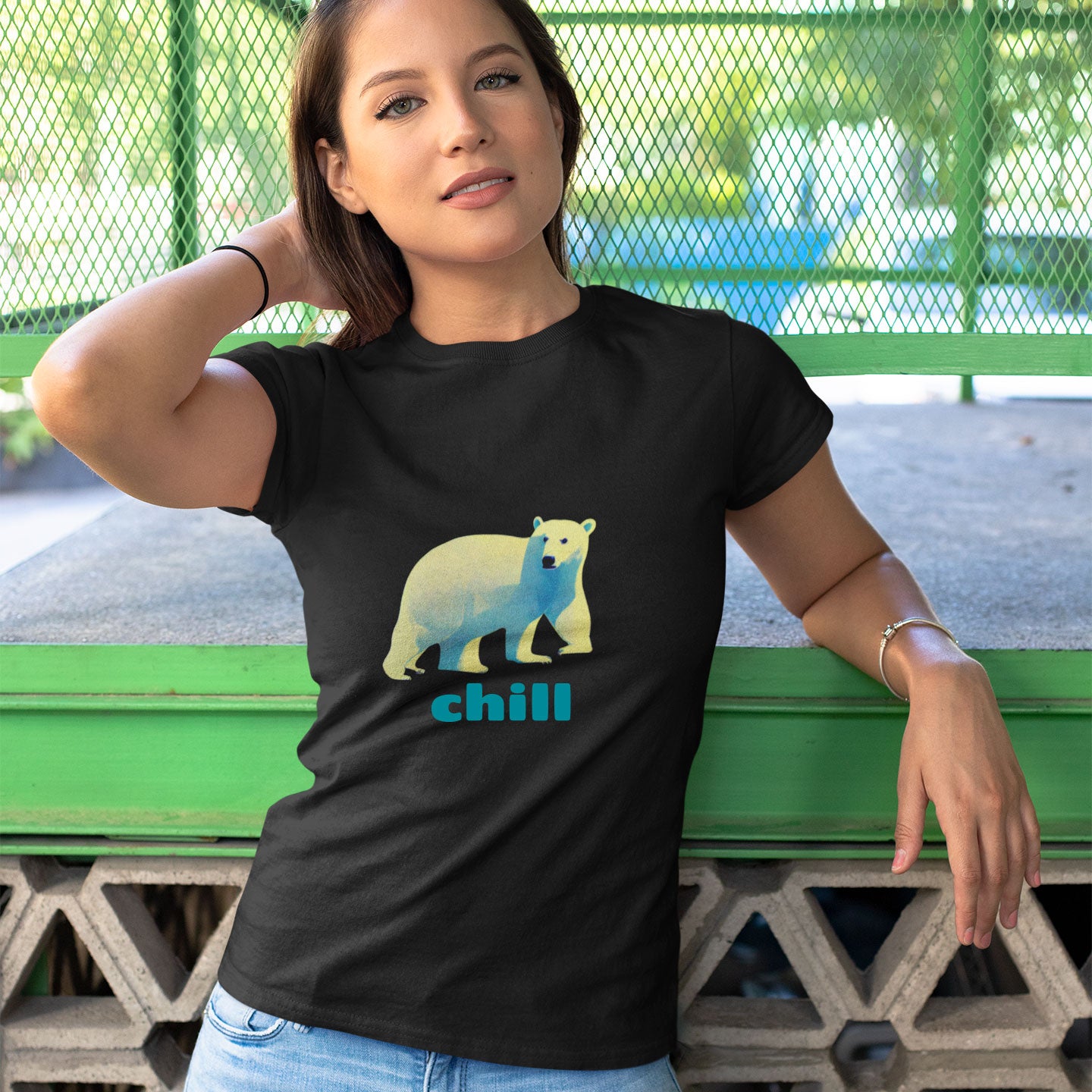 Woman wearing a black t-shirt with a polar bear print with chill caption
