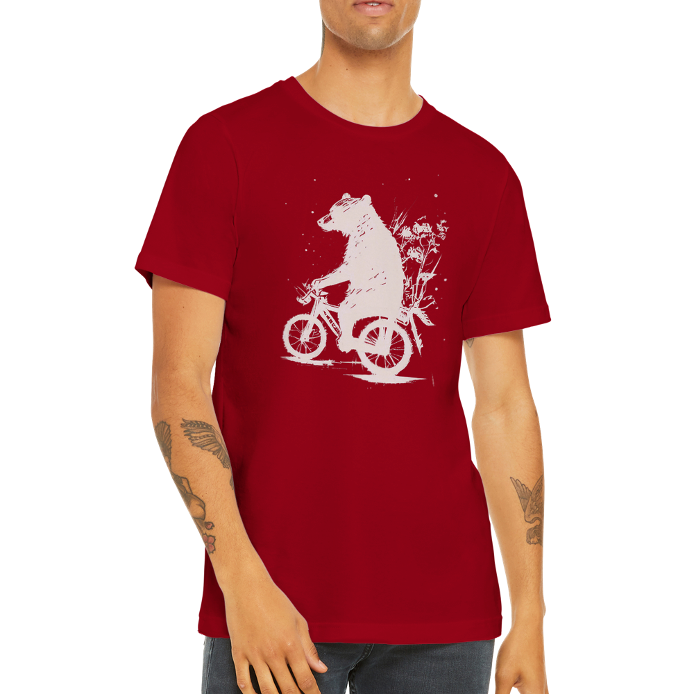 A guy wearing a red t-shirt with a bear riding a bike print
