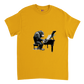 Gold t-shirt with a chimp playing the piano print