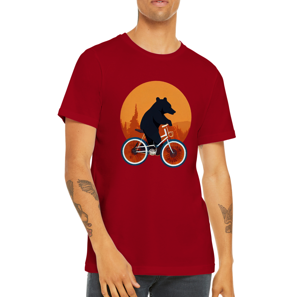 A guy  wearing a red t-shirt with a bear riding a bike print