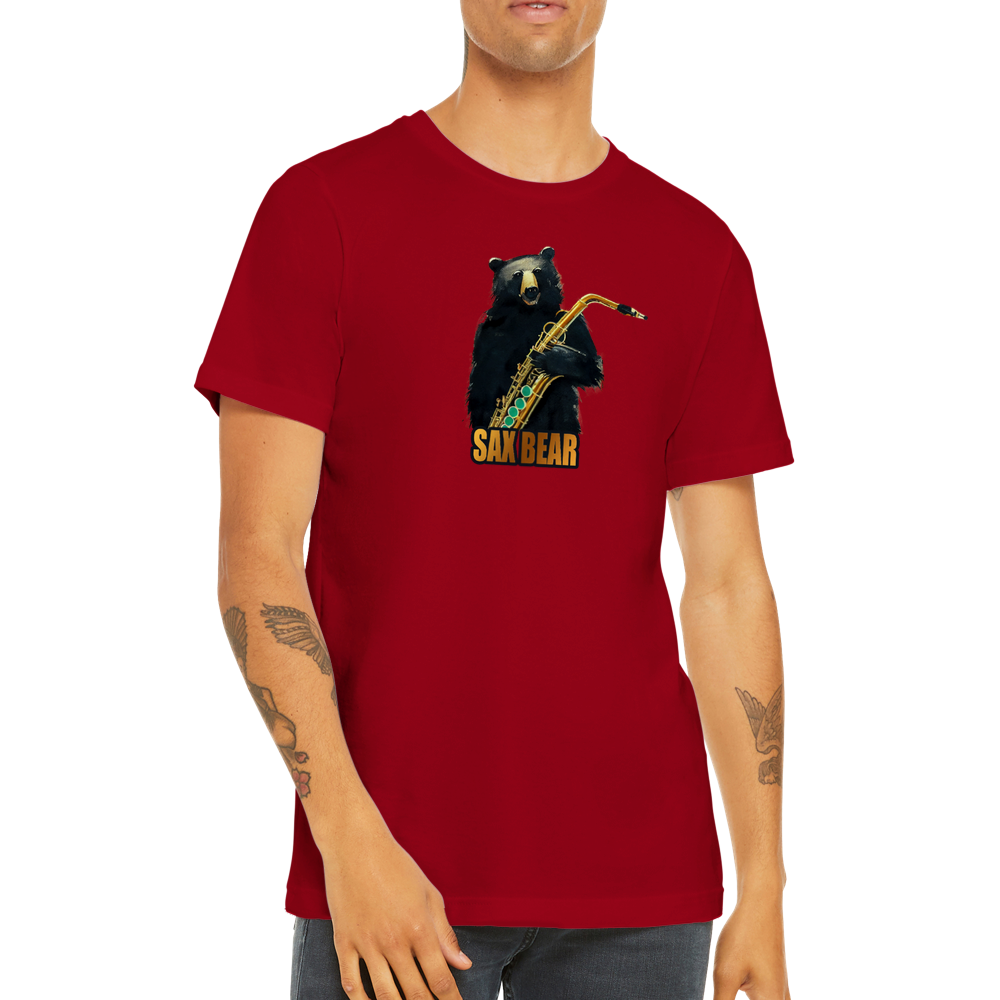 Guy wearing a red t-shirt with a print of a bear holding a saxophone with the caption Sax Bear