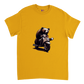 Gold t-shirt with a bear riding a motor scooter