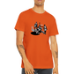 a man wearing a orange t-shirt with a jazz trio print