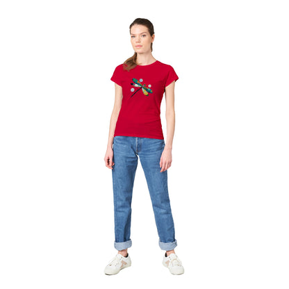 Woman wearing a red t-shirt with an abstract colourful dragonfly print