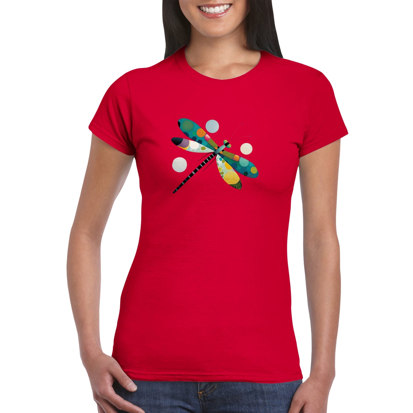 Woman wearing a red t-shirt with an abstract colourful dragonfly print